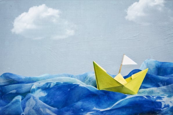 Paper boat in a storm